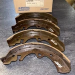 Nissan Brake Shoe 44060-DO125 Set Of Genuine Parts Loc Zz. Fixed Price $80.00.